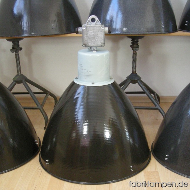 Industrial lamps with gray enameled shades. Material: gray enameled sheet and aluminium. The lamps are cleaned, newly electrified, with E40 sockets – adapters for E27 are inclusive, so the lamps can be used with E27 bulbs. Total height: ca. 63 cm (24,8 inches). Diameter of the shade ca. 53 cm (20,9 inches).
20 pieces available