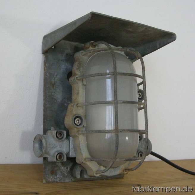 Very robust mine lamp (explosionsproof) with grid. Material: casted iron and steel (safety grid). The lamp is cleaned and newly electrified, it can be used with E27 bulb. Total height: ca. 28 cm (11 inches, width ca 26 cm (10,2 inches).
