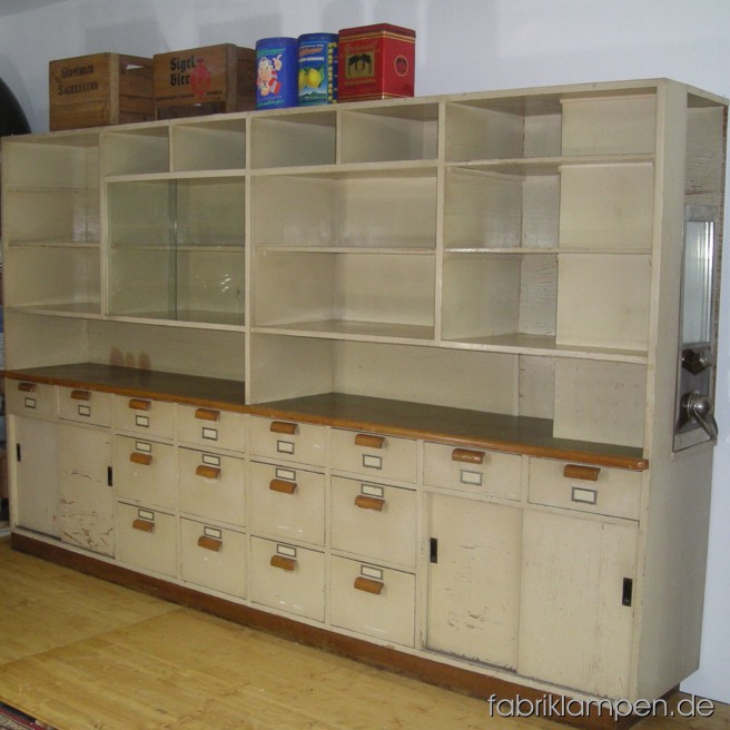 Old store furnishing in nice original condition. Length ca. 322 cm (127 inches), height ca. 195 cm (77 inches).
