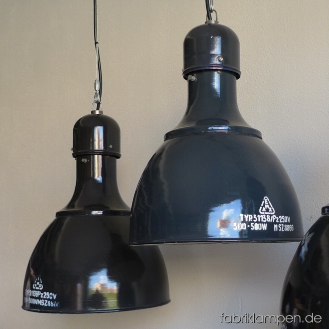 Very rare gray and black industrial lamps with enameled shades. Material: black or gray enameled sheet. The lamps are cleaned, newly electrified, mounted with with E40/E27 sockets. Height of the lamps ca. 47,5 cm (18,7 inches), diameter of the shades ca. 36 cm (14,1 inches).