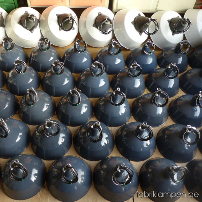 Nice collection of old enamel factory lamps for a restaurant in Schwitzerland.