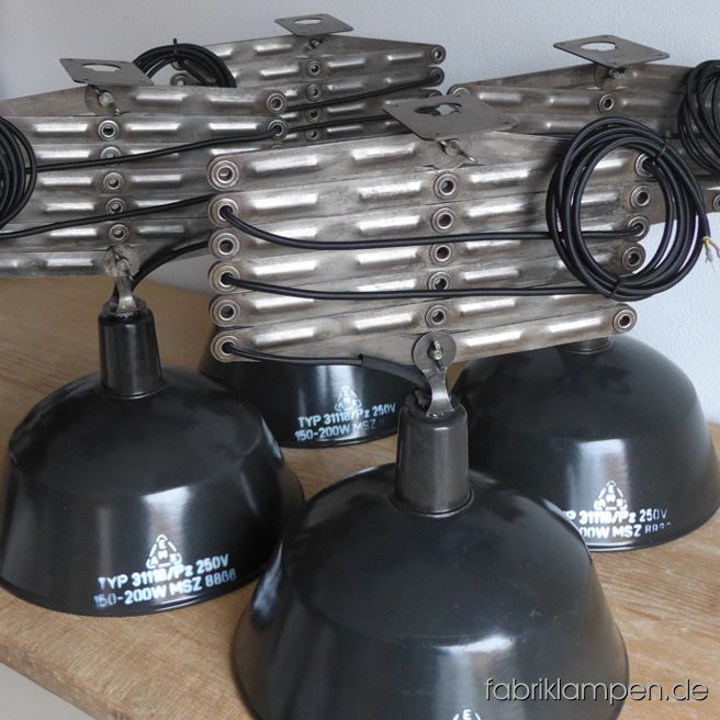 According to the to the customer’s wish: scissor lamps made of old shades with new scissors for a coffeeshop in Vienna. Maximal length over 2 meters, diameter of the shades 36 cm. 