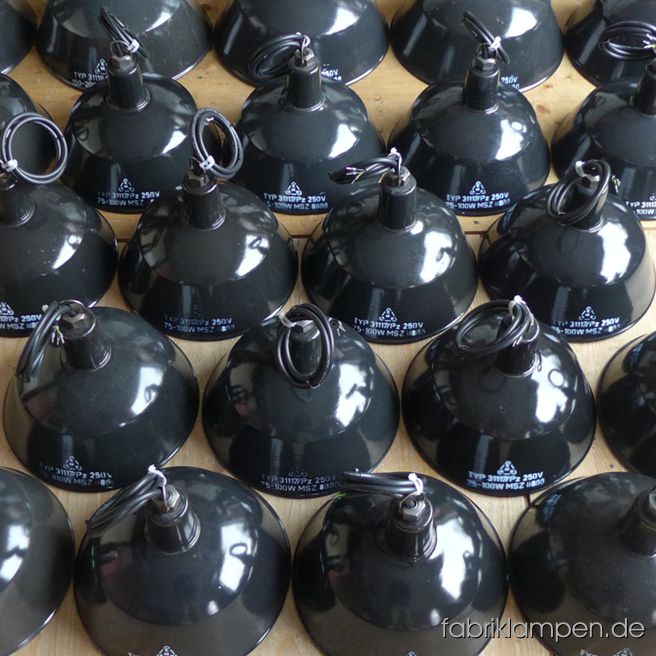 Nice group of smaller black enameled lamps with label for a bureau in Berlin. Diameter 25 cm.